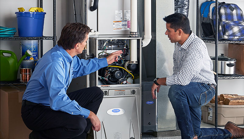HVAC technician evaluating a furnace for repair or replacement in Castle Rock