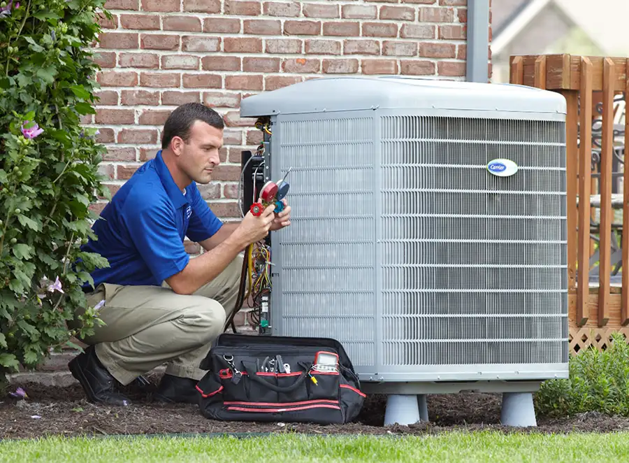 HVAC technician inspecting an outdoor air conditioning unit in Castle Rock